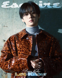 Lee know stray kids on the cover of esquire magazine with blue sweetshirt